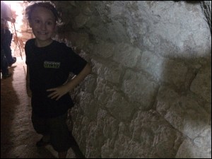 In the tunnel, next to the original wall of one of the temples